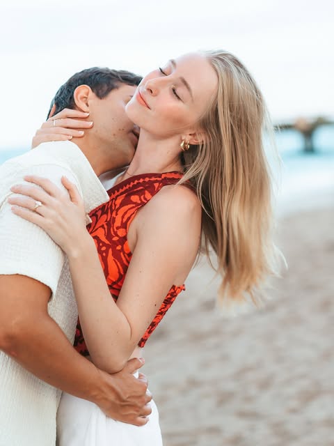A couple embracing on the beach